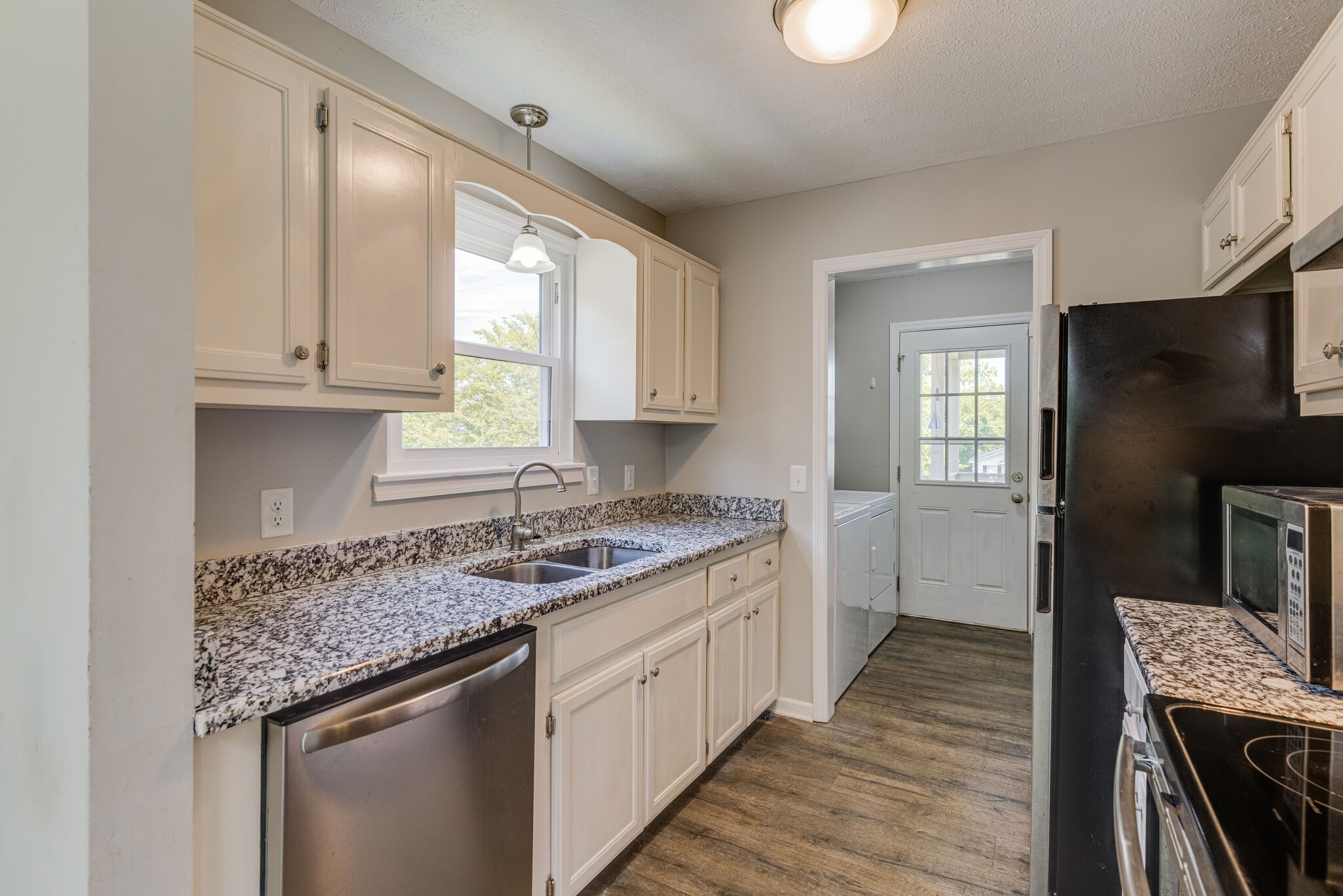 4752 Lahr Road Springfield, TN 37172 - Photo 8 of 27 a kitchen with a sink stove and refrigerator