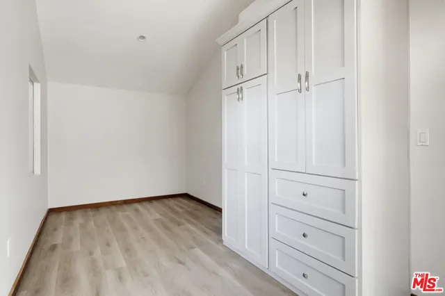 a view of a closet in kitchen