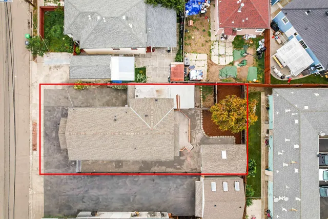 an aerial view of a houses with a city view