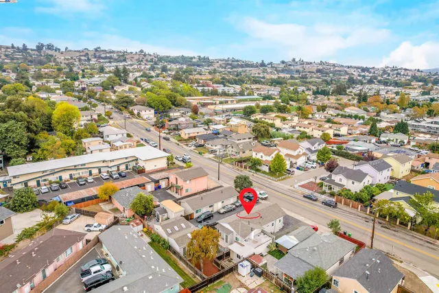 an aerial view of residential houses with outdoor space