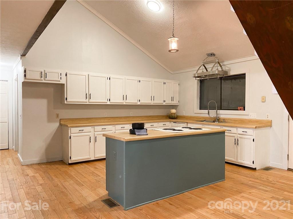 814 Calhoun Trail Rutherfordton, NC 28139 - Photo 11 of 14 a kitchen with stainless steel appliances granite countertop a sink and a stove