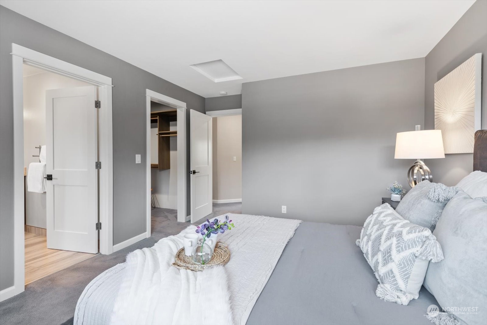 815 213th Street Southeast Bothell, WA 98021 - Photo 19 of 37 a bedroom with a bed and a lamp