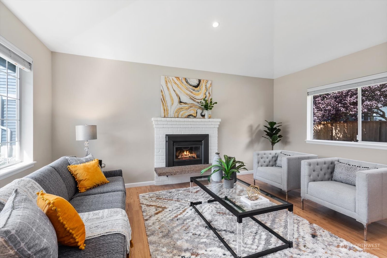 815 213th Street Southeast Bothell, WA 98021 - Photo 3 of 37 a living room with furniture and a fireplace