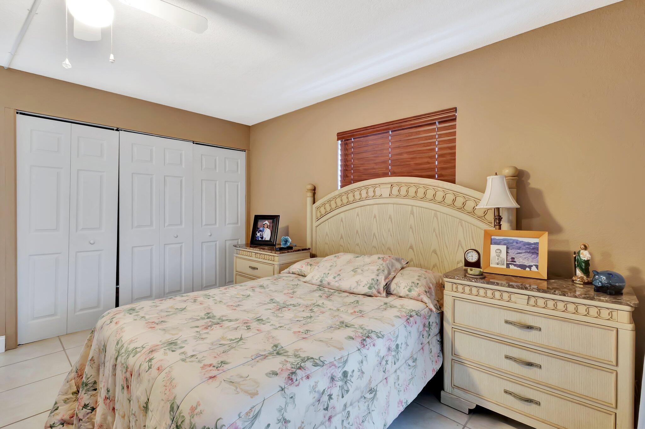 637 Monaco Court, Unit 637 Delray Beach, FL 33446 - Photo 15 of 58 a bedroom with a bed and a dresser