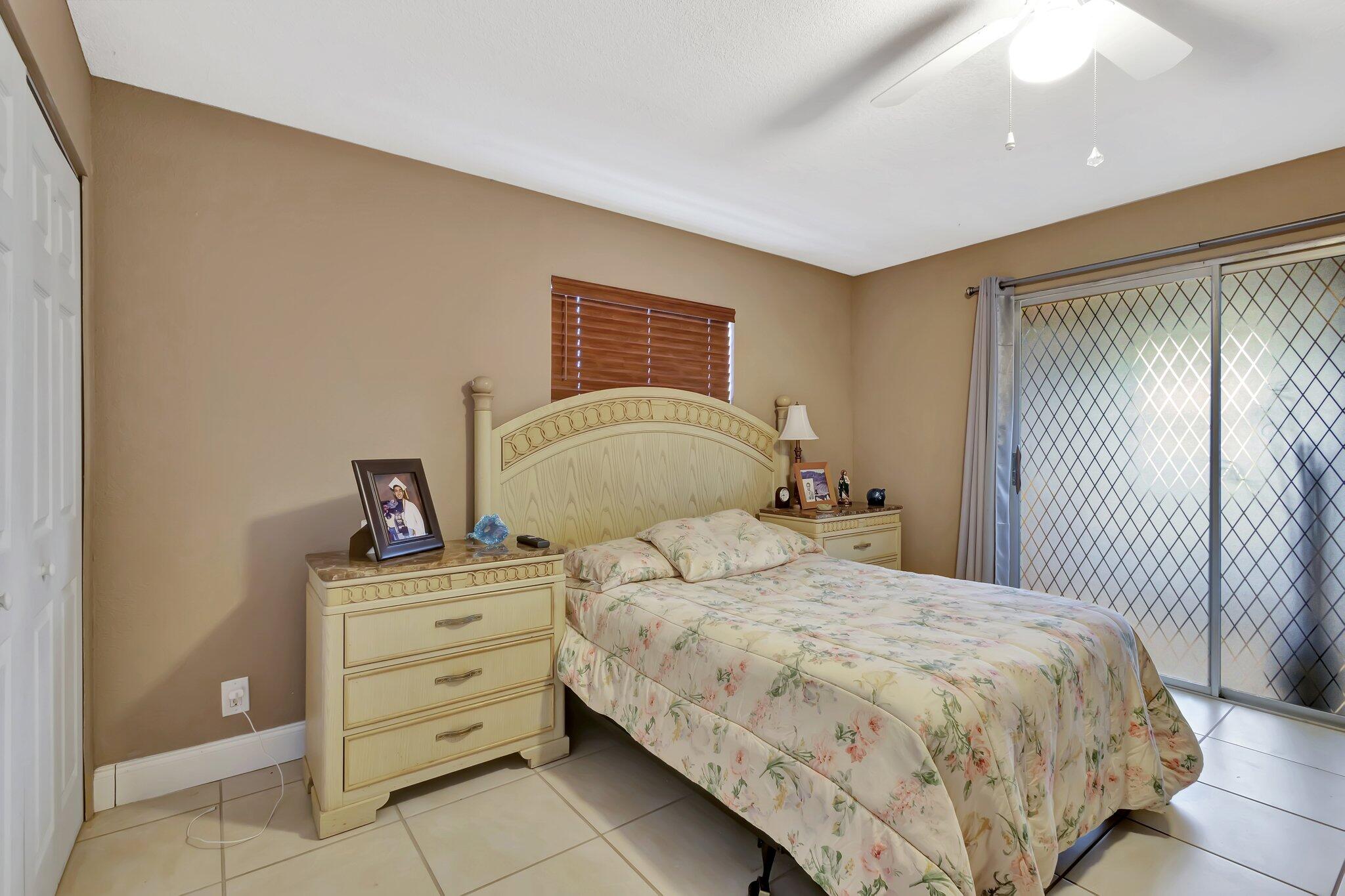 637 Monaco Court, Unit 637 Delray Beach, FL 33446 - Photo 16 of 58 a bedroom with a bed and a window