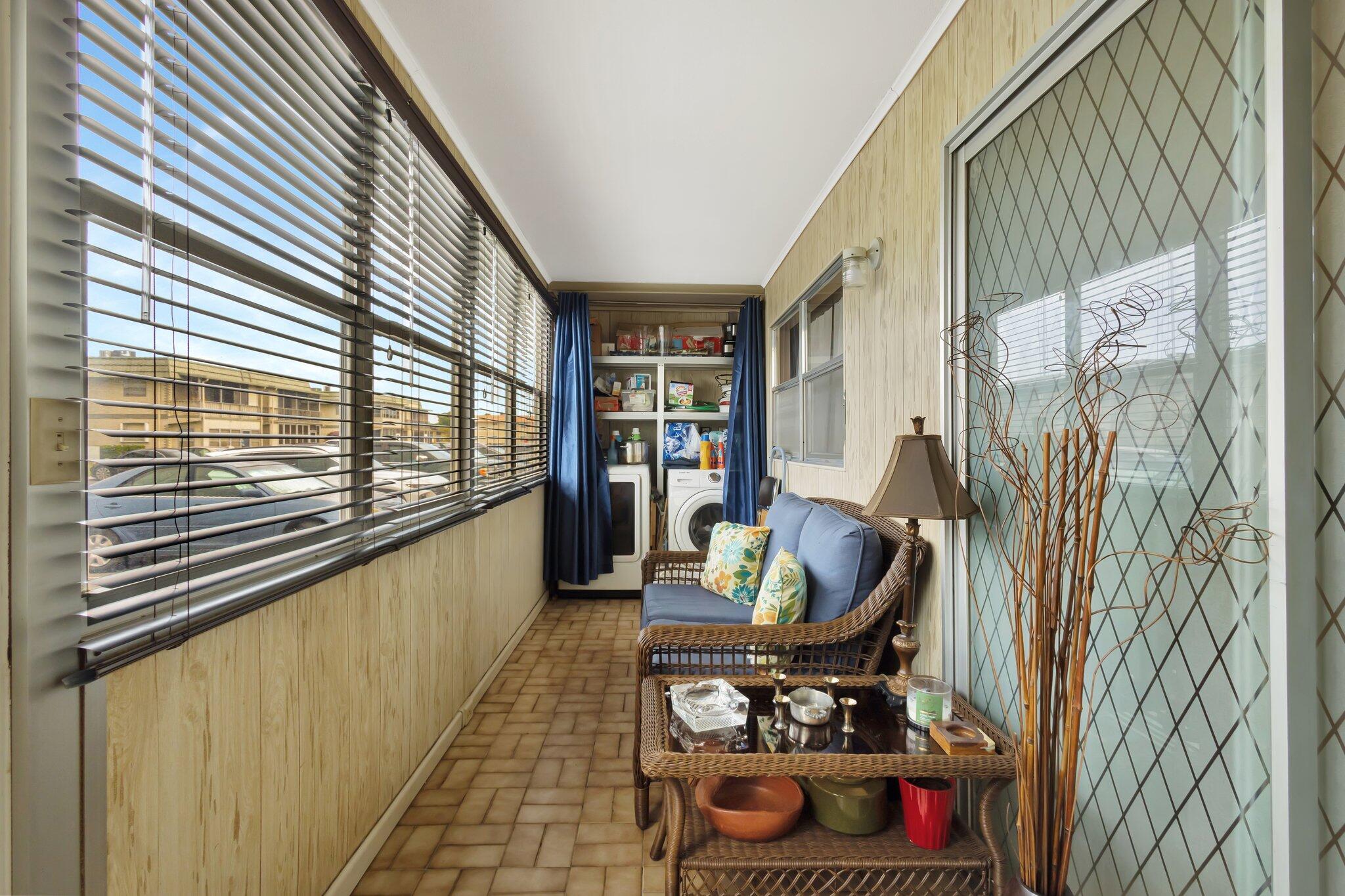 637 Monaco Court, Unit 637 Delray Beach, FL 33446 - Photo 20 of 58 a living room with furniture and a floor to ceiling window