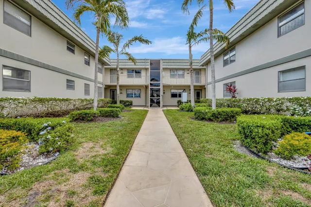 a view of house with yard