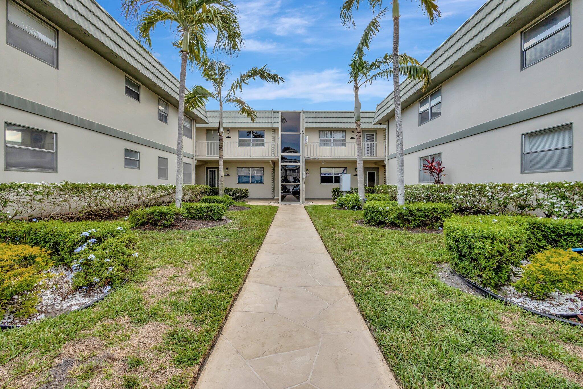 637 Monaco Court, Unit 637 Delray Beach, FL 33446 - Photo 21 of 58 a view of house with yard