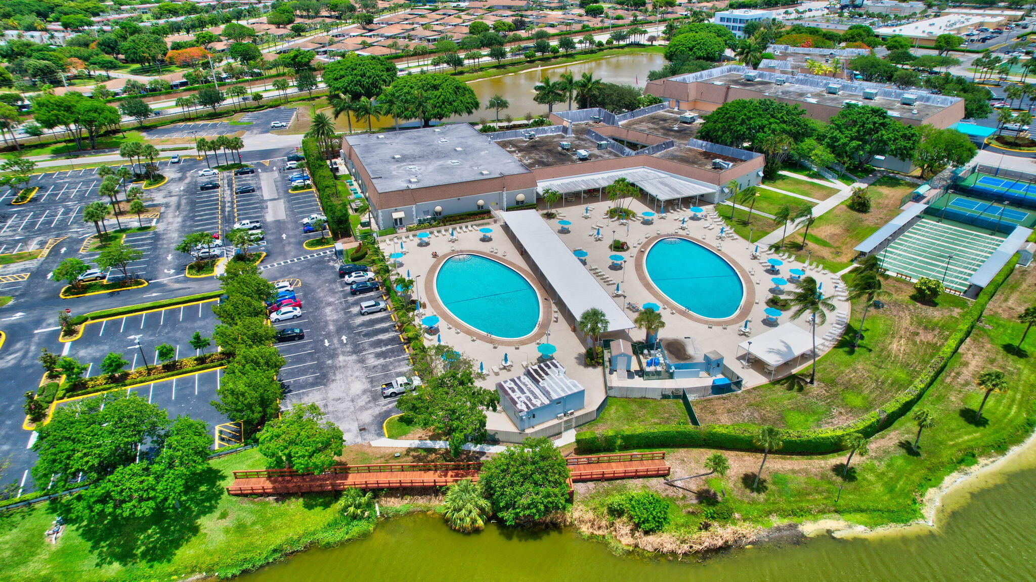 637 Monaco Court, Unit 637 Delray Beach, FL 33446 - Photo 56 of 58 an aerial view of a house with a swimming pool outdoor seating and yard