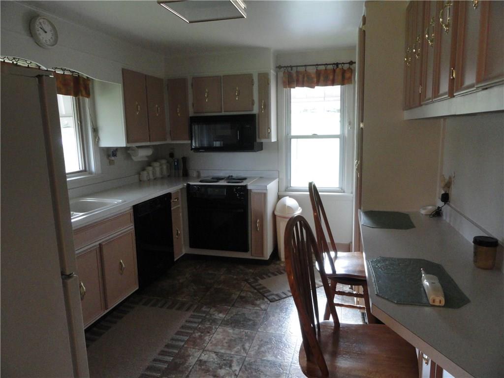 Updated kitchen with appliances. Breakfast bar and pantry.