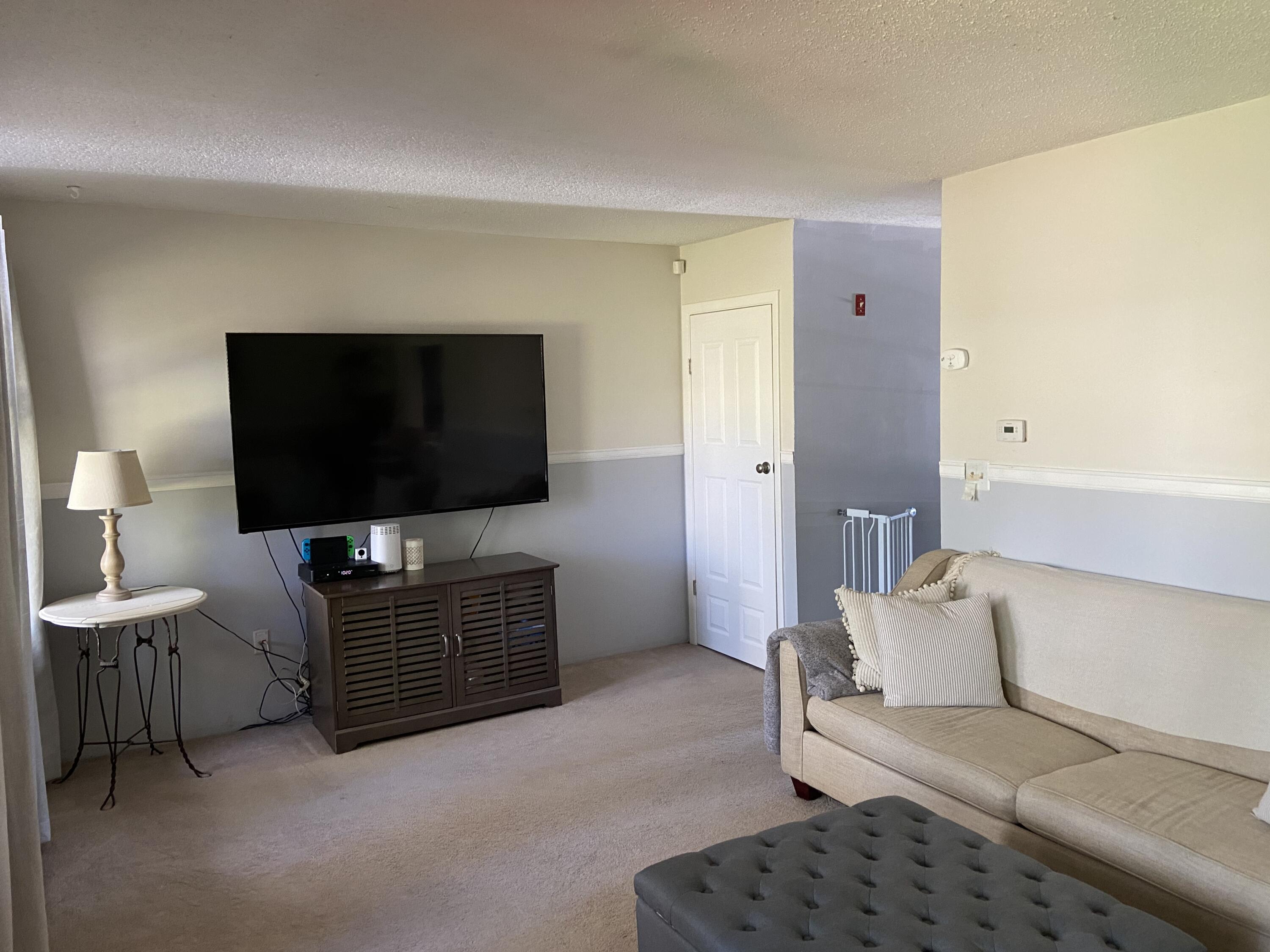7 Roberta Drive, Unit G Buzzards Bay, MA 02532 - Photo 3 of 13 a living room with furniture and a flat screen tv