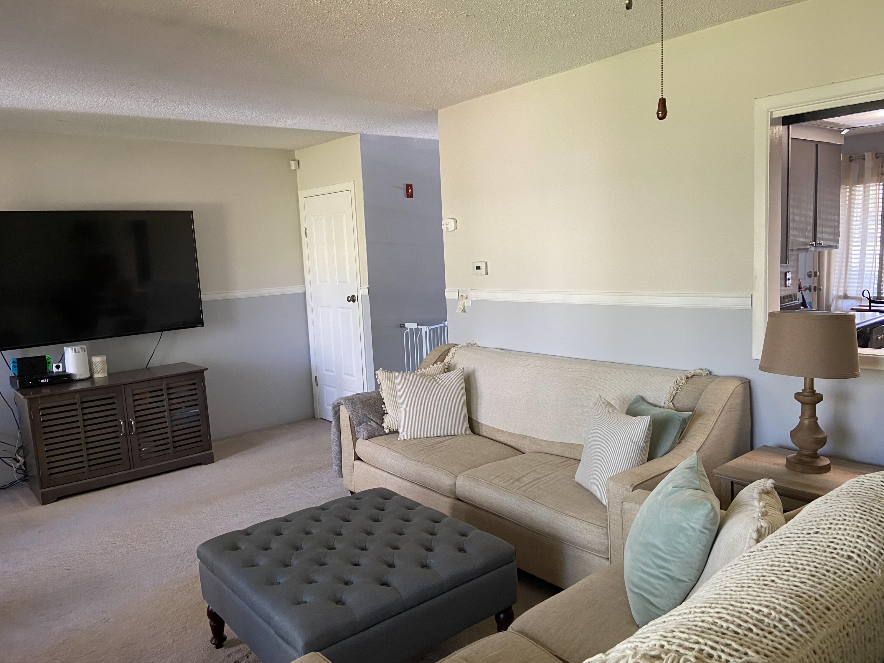 7 Roberta Drive, Unit G Buzzards Bay, MA 02532 - Photo 5 of 13 a living room with furniture and a flat screen tv