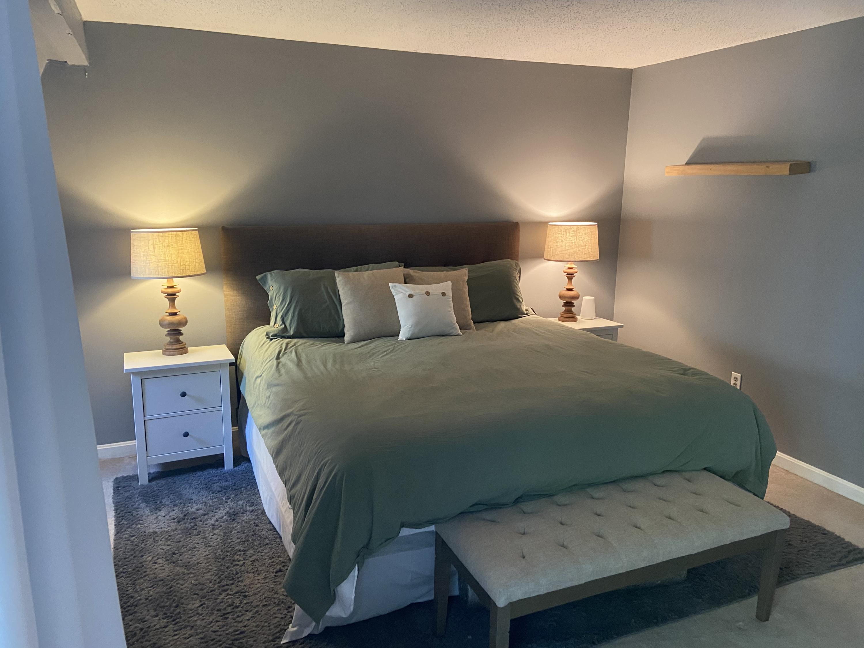 7 Roberta Drive, Unit G Buzzards Bay, MA 02532 - Photo 10 of 13 a bedroom with a bed and a lamp