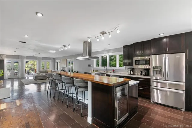 a kitchen with lots of counter top space and stainless steel appliances