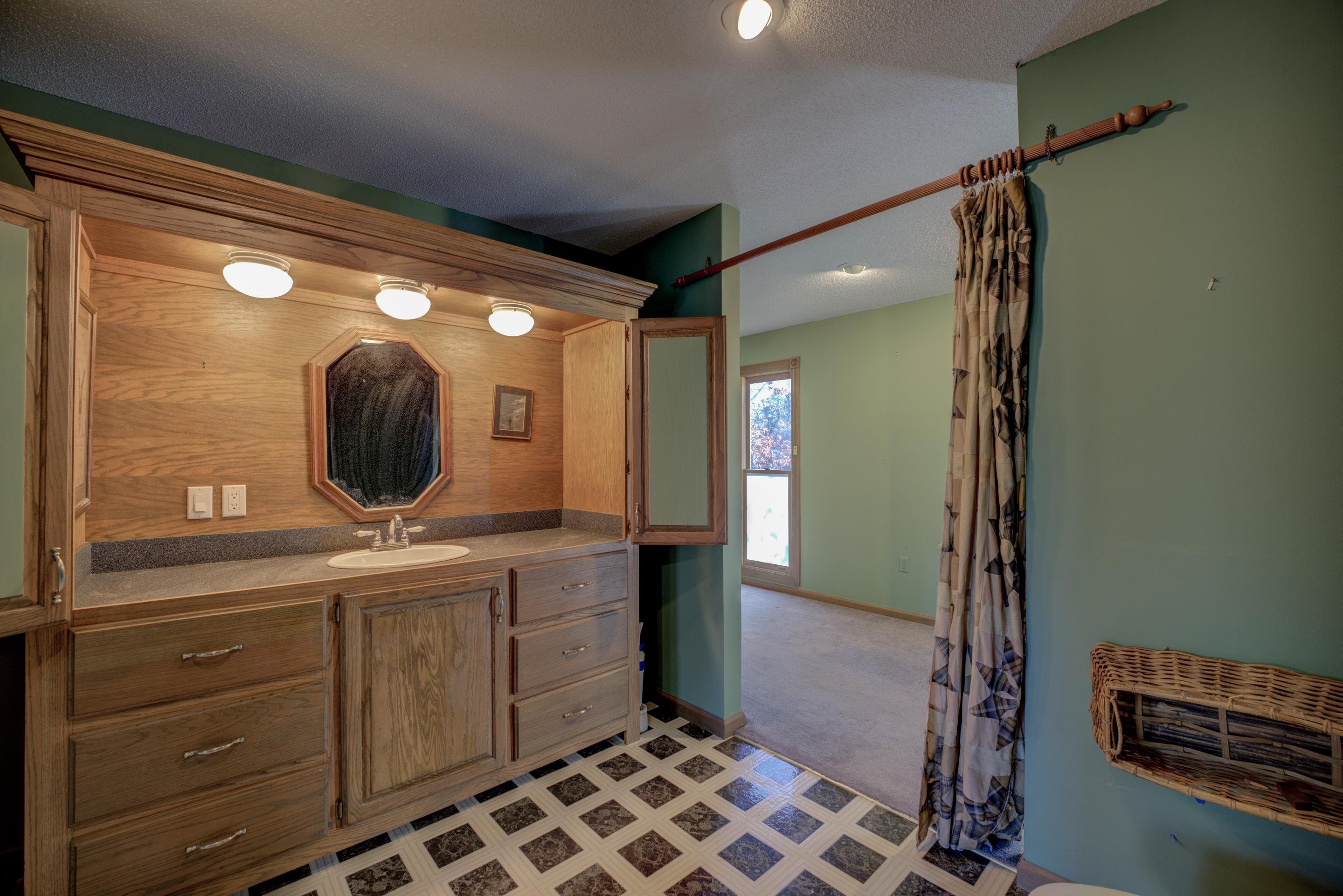 183 Matlock Road Ramer, TN 38367 - Photo 11 of 34 a bathroom with a mirror and a sink