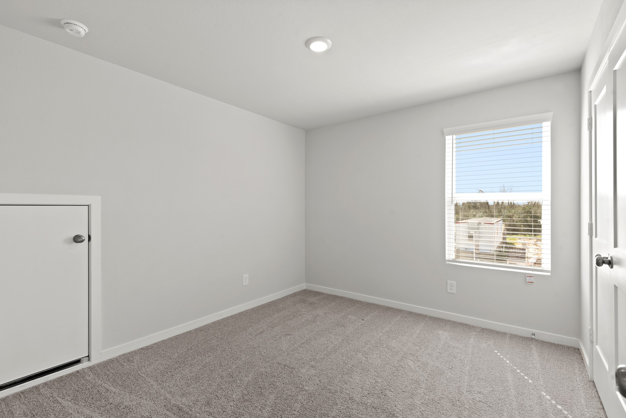 17211 King Eider Road Waller, TX 77484 - Photo 17 of 30 an empty room with a window
