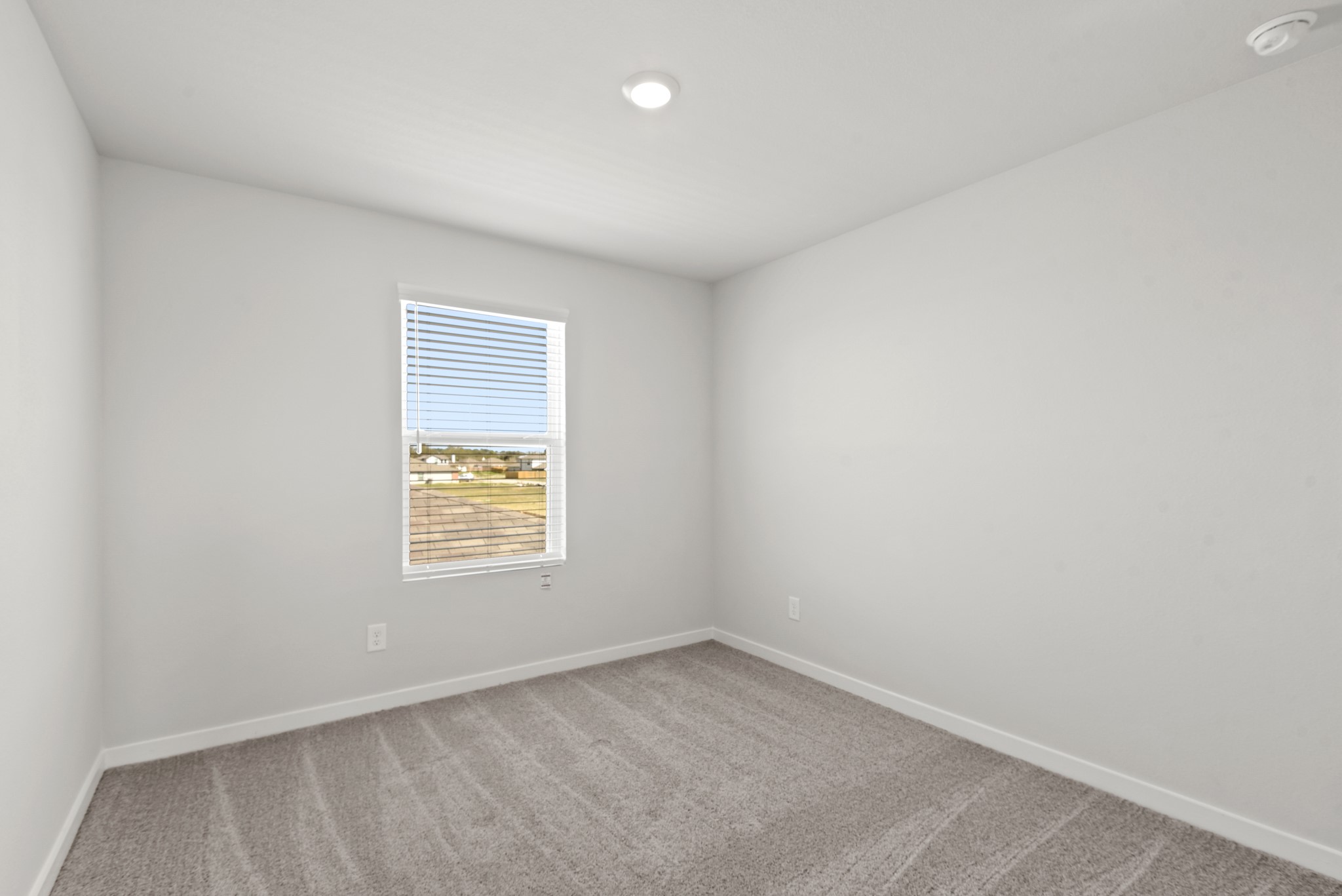 17211 King Eider Road Waller, TX 77484 - Photo 19 of 30 an empty room with a window