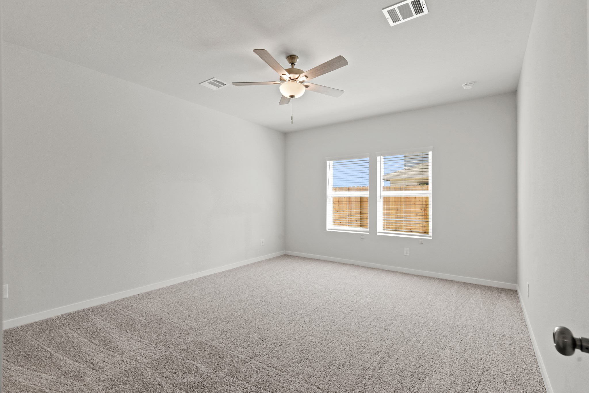 17211 King Eider Road Waller, TX 77484 - Photo 7 of 30 a view of a livingroom with a ceiling fan and window