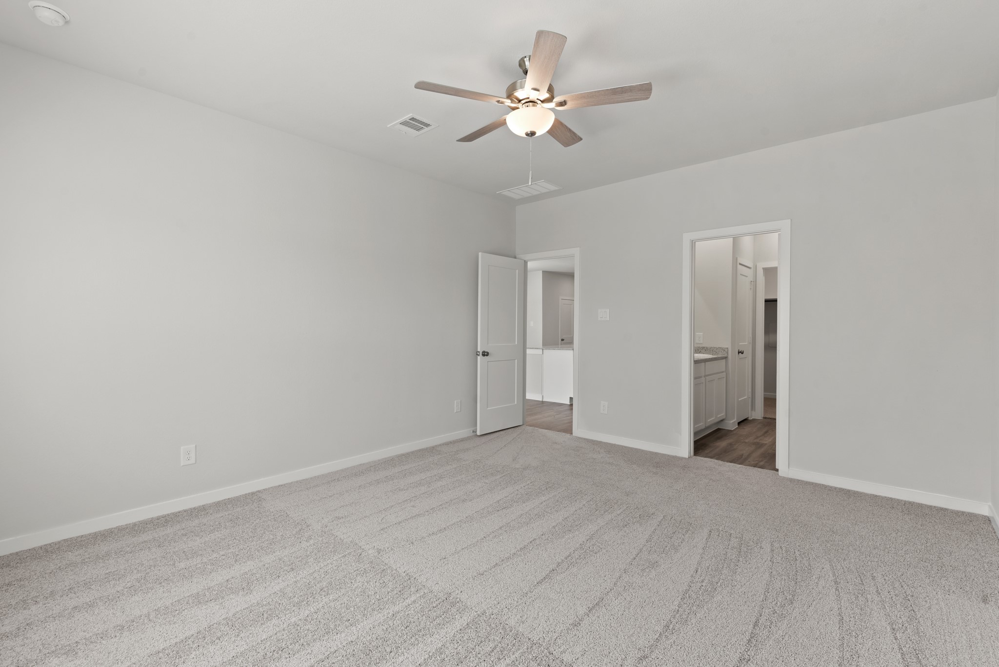 17211 King Eider Road Waller, TX 77484 - Photo 8 of 30 a view of an empty room with a ceiling fan