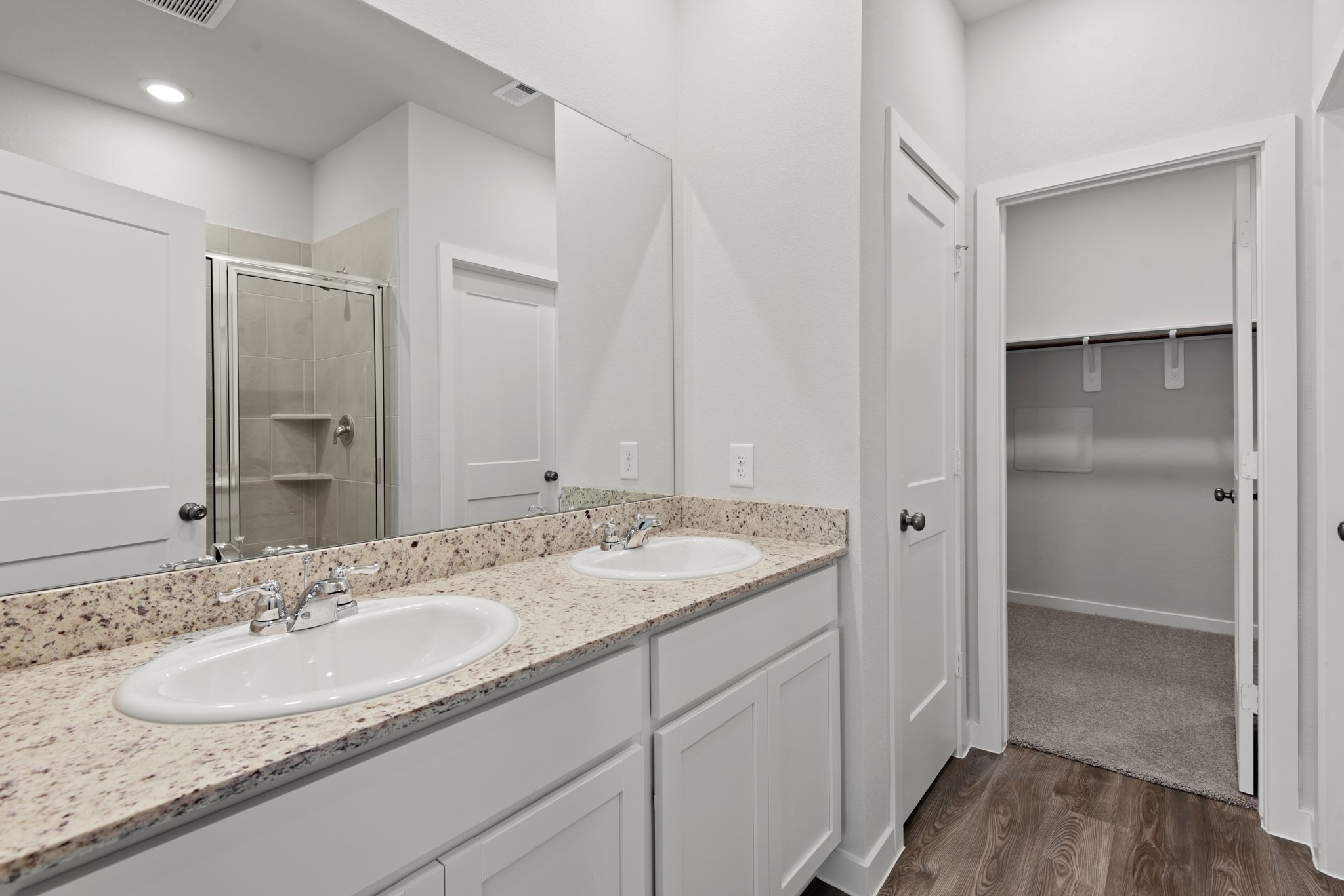 17211 King Eider Road Waller, TX 77484 - Photo 9 of 30 a bathroom with a granite countertop sink and a mirror