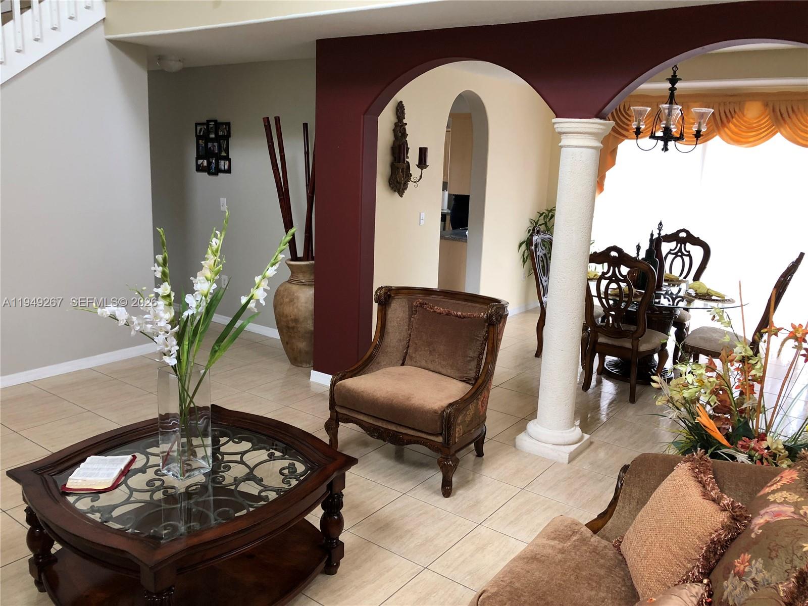 15364 Southwest 32nd Terrace Miami, FL 33185 - Photo 2 of 14 a living room with furniture and a potted plant