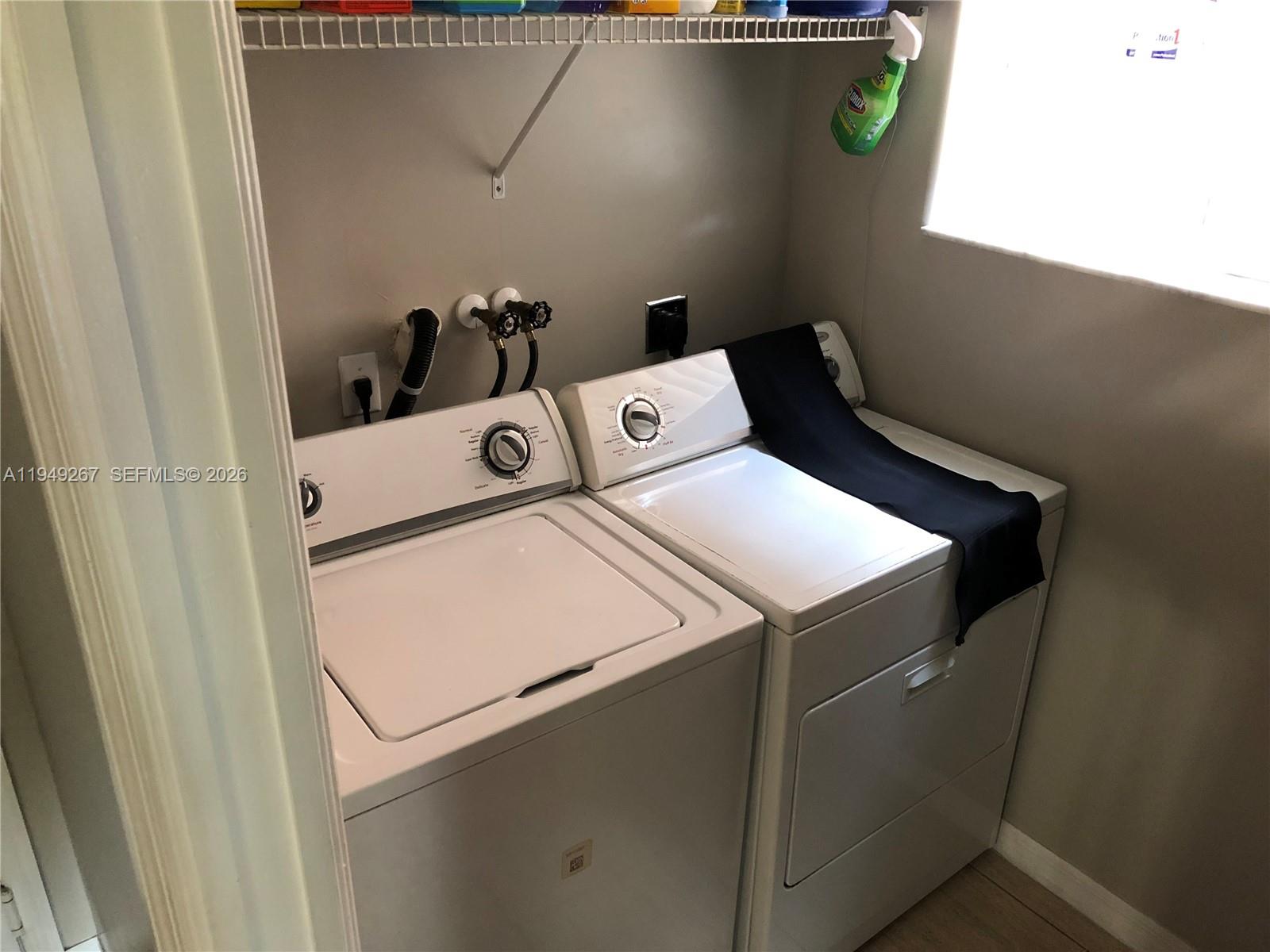 15364 Southwest 32nd Terrace Miami, FL 33185 - Photo 5 of 14 a utility room with dryer and washer