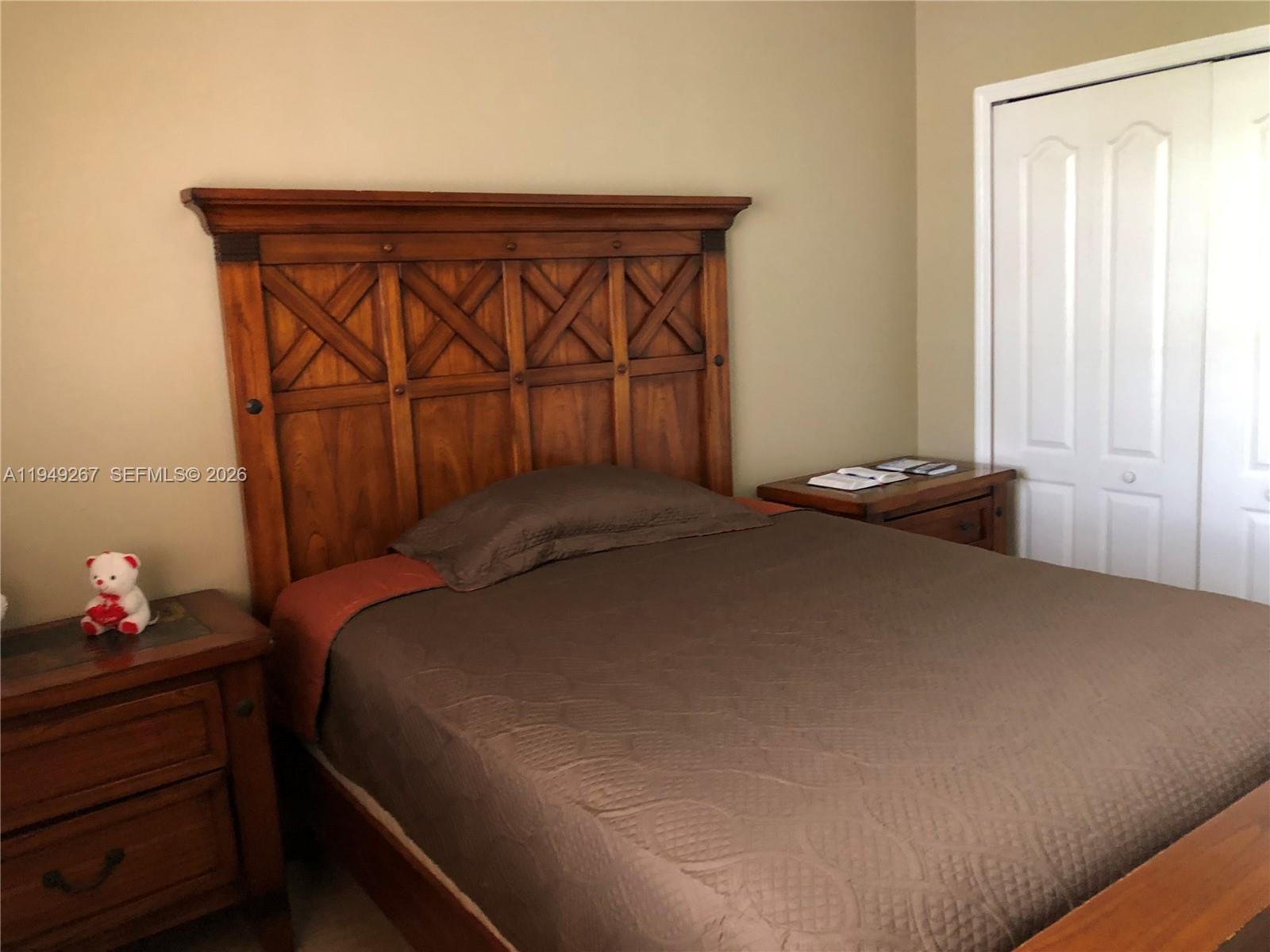 15364 Southwest 32nd Terrace Miami, FL 33185 - Photo 8 of 14 a bedroom with a bed and a window