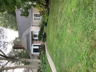 41 Woodbine Road East Hills, NY 11577 - Photo 3 of 15 View of front facade with a front yard and a chimney