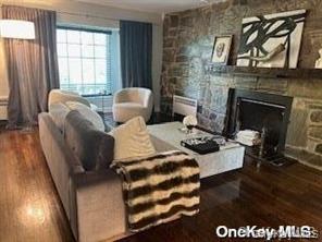 41 Woodbine Road East Hills, NY 11577 - Photo 8 of 15 a living room with furniture and a fireplace