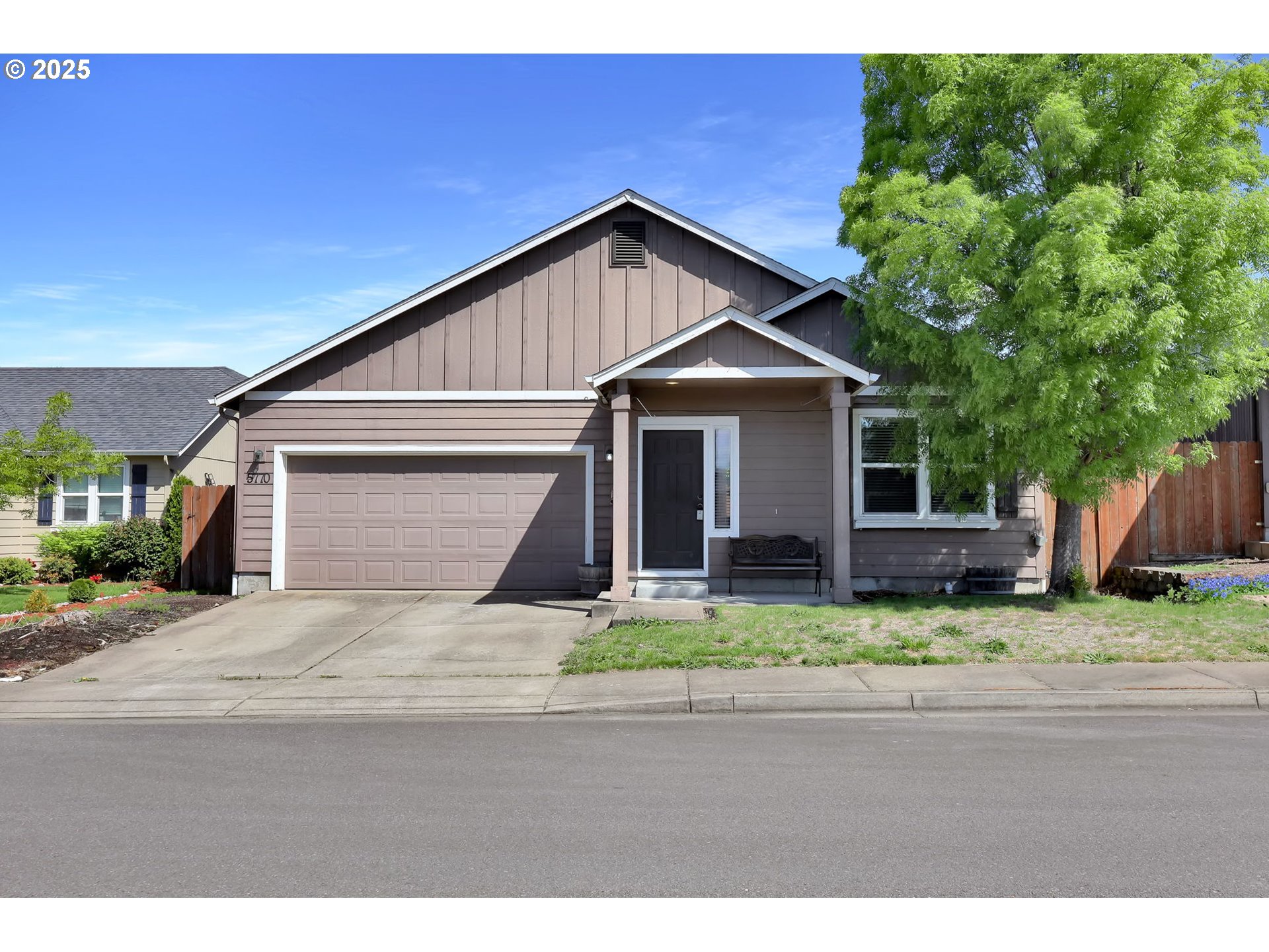 5770 Mineral Way Springfield, OR 97478 - Photo 1 of 18 a front view of a house with a yard and garage