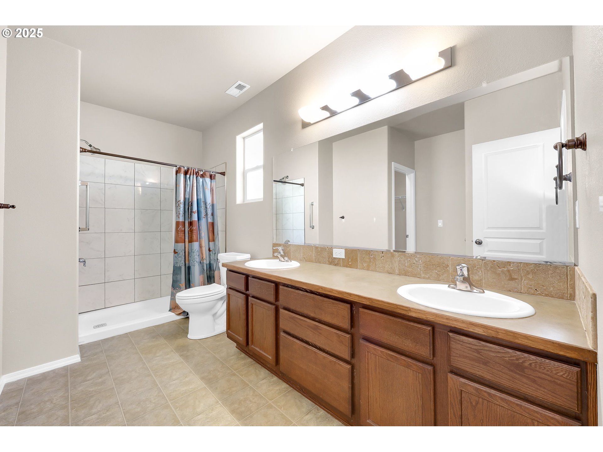 5770 Mineral Way Springfield, OR 97478 - Photo 12 of 18 a bathroom with a granite countertop sink mirror and shower
