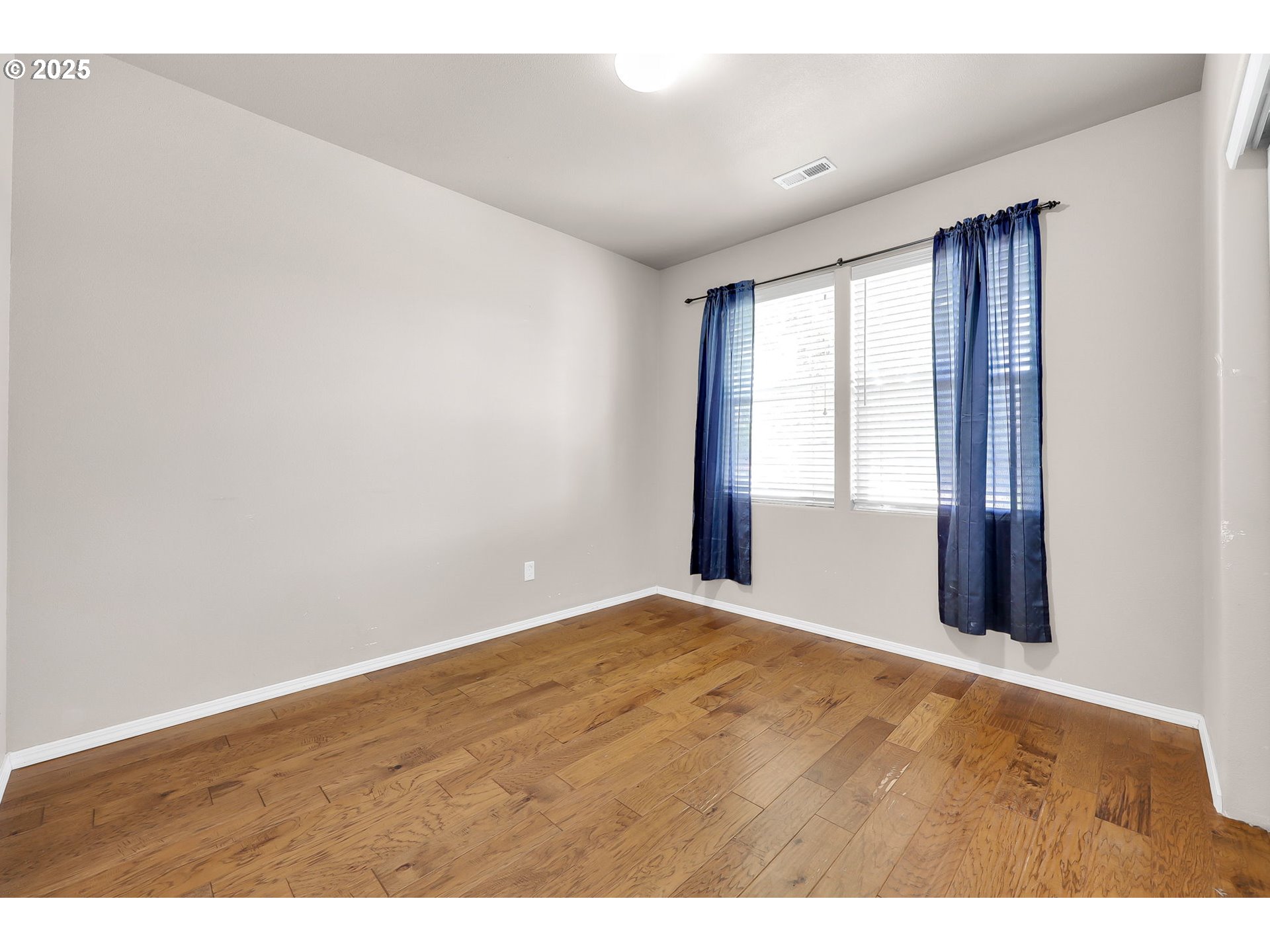 5770 Mineral Way Springfield, OR 97478 - Photo 13 of 18 a view of an empty room with wooden floor and a window