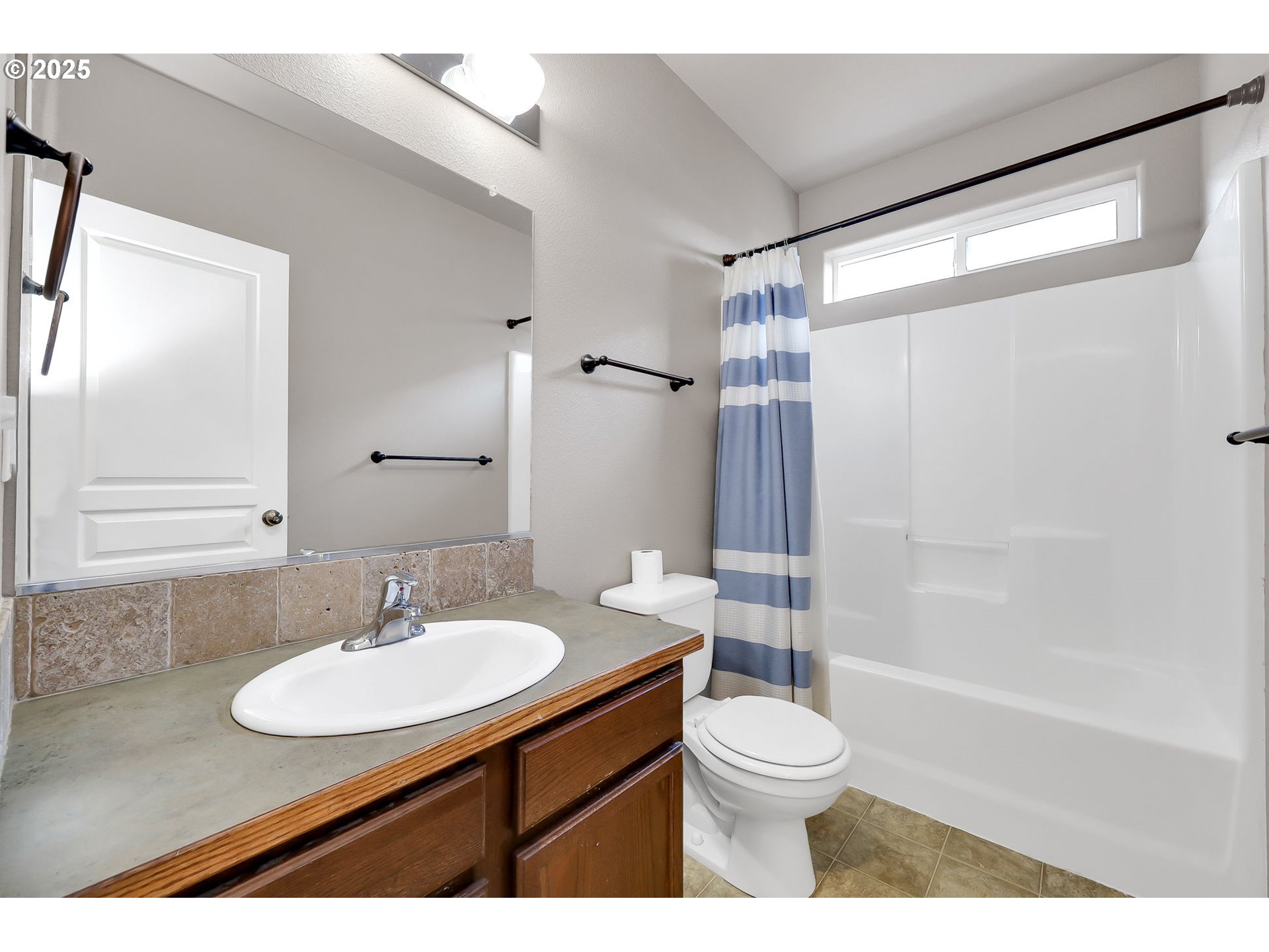 5770 Mineral Way Springfield, OR 97478 - Photo 15 of 18 a bathroom with a sink toilet a mirror and shower