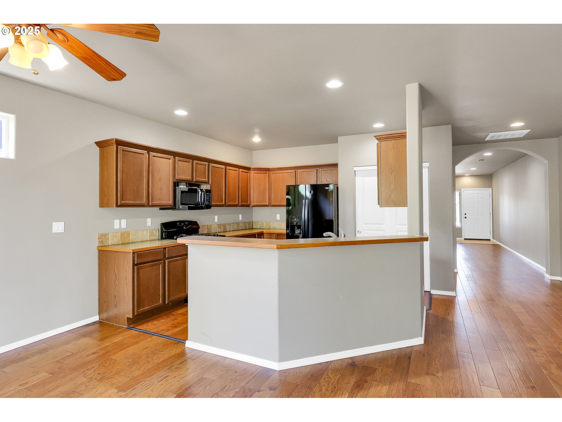 5770 Mineral Way Springfield, OR 97478 - Photo 5 of 18 a kitchen with stainless steel appliances granite countertop a refrigerator a sink a stove and oven