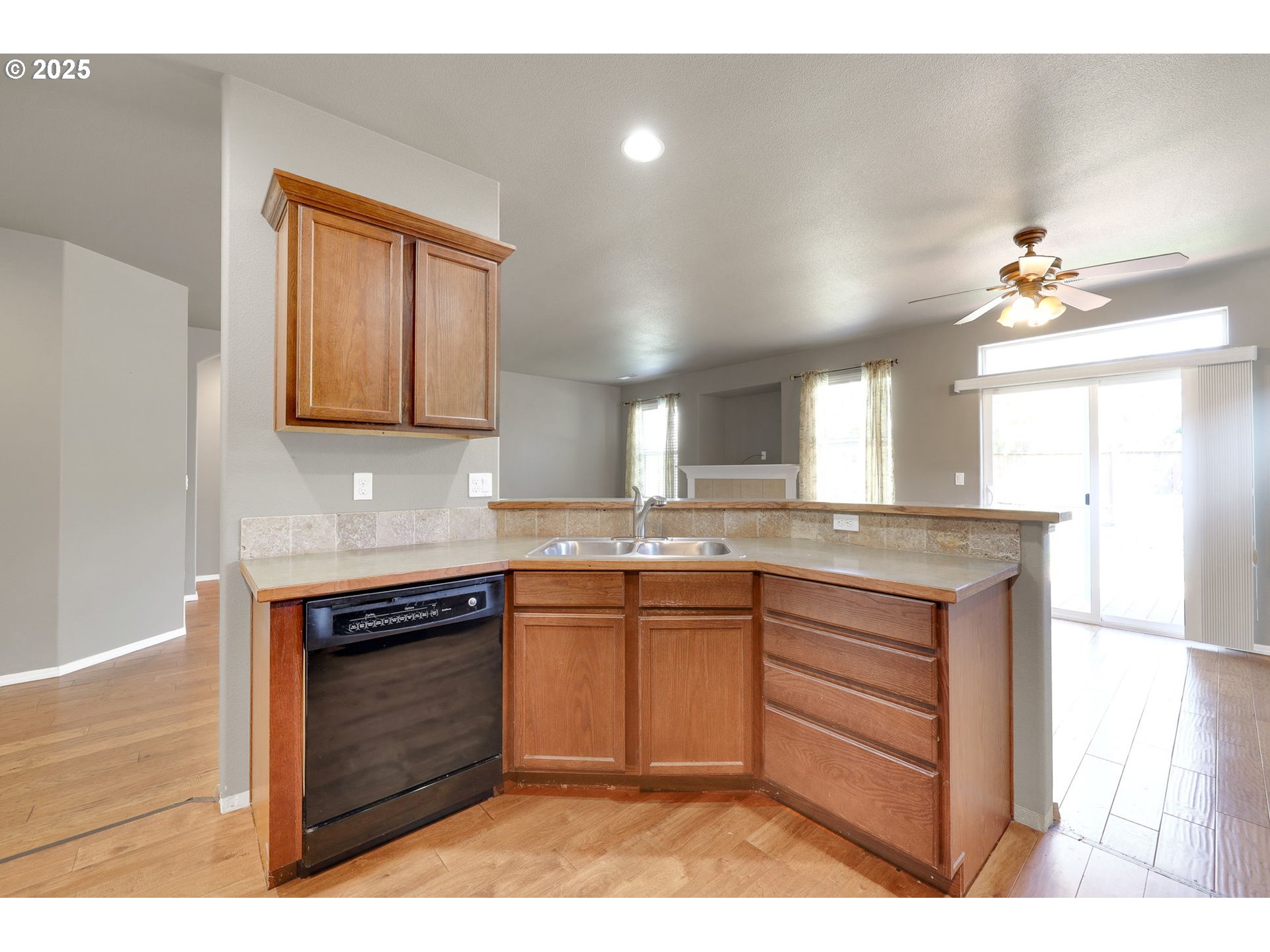 5770 Mineral Way Springfield, OR 97478 - Photo 7 of 18 a kitchen with stainless steel appliances granite countertop a sink stove and cabinets