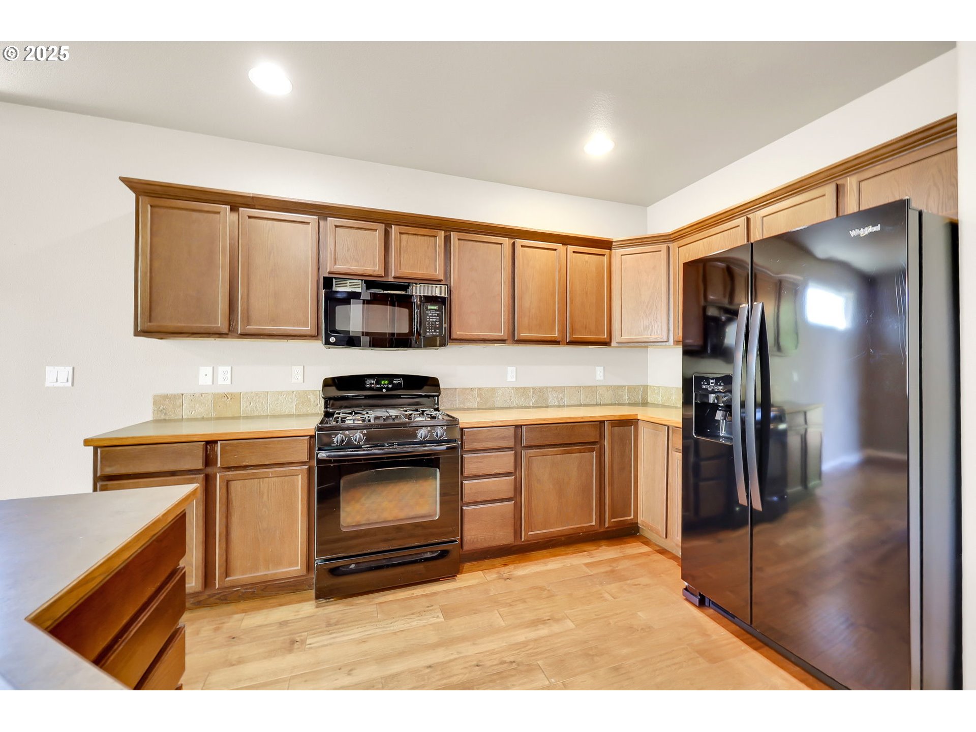 5770 Mineral Way Springfield, OR 97478 - Photo 8 of 18 a kitchen with stainless steel appliances granite countertop a stove a sink and a refrigerator