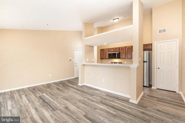 a view of a kitchen with a sink and an oven