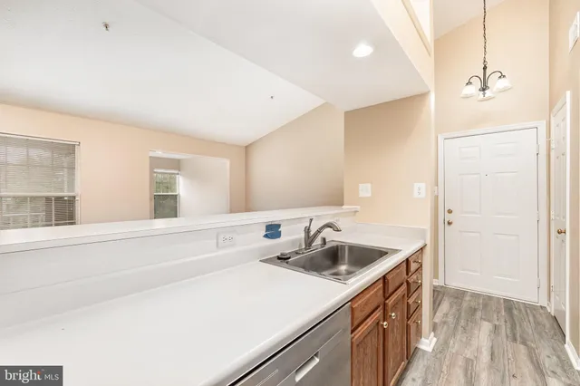 a kitchen with a sink and a refrigerator