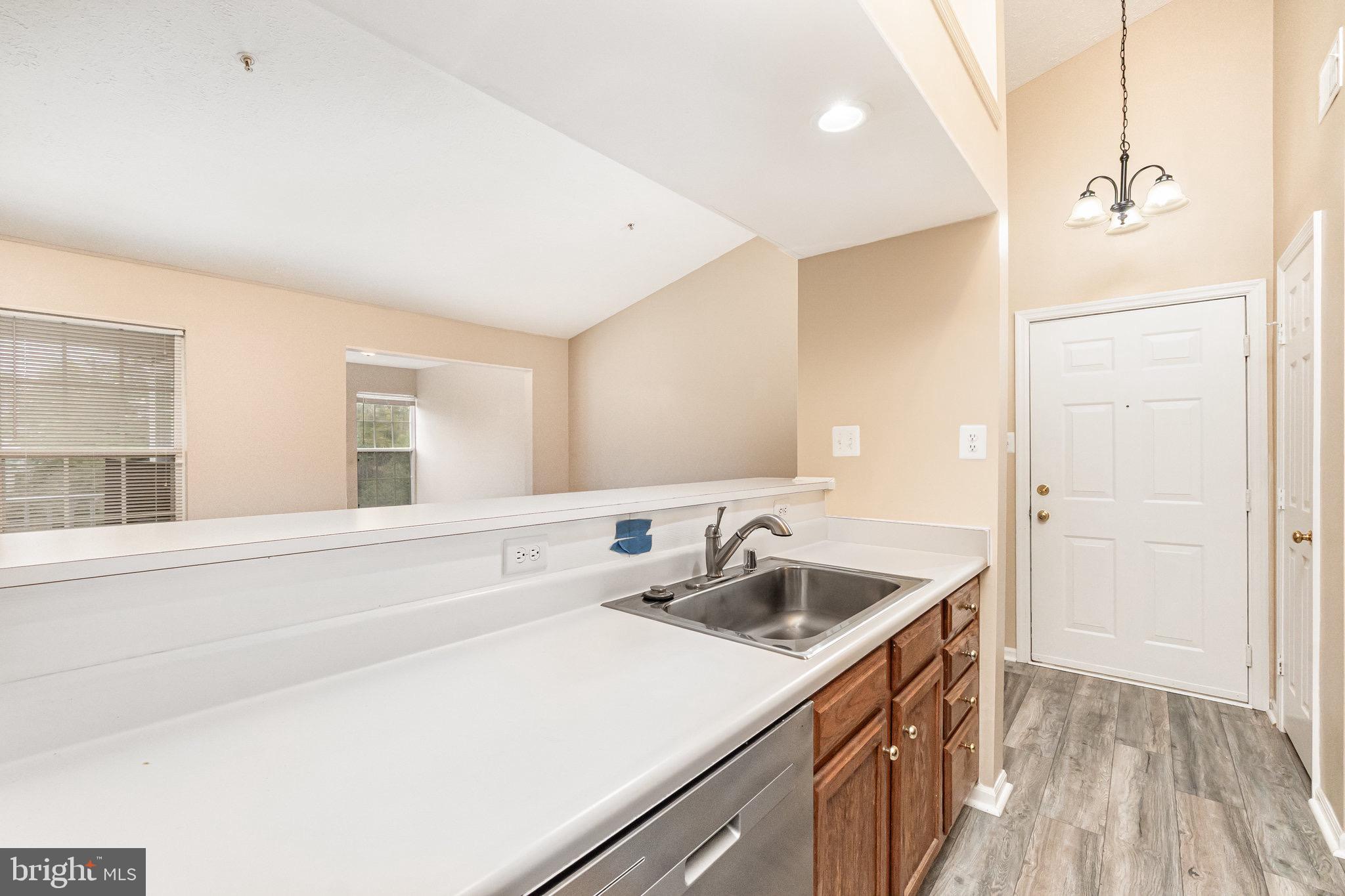 1401 Sage Lane, Unit 1401M Belcamp, MD 21017 - Photo 14 of 30 a kitchen with a sink and a refrigerator