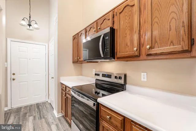 a kitchen with a stove and a microwave