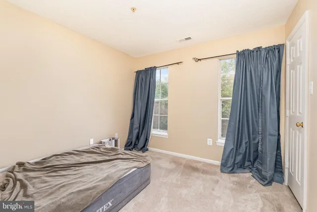 a view of a bedroom with closet