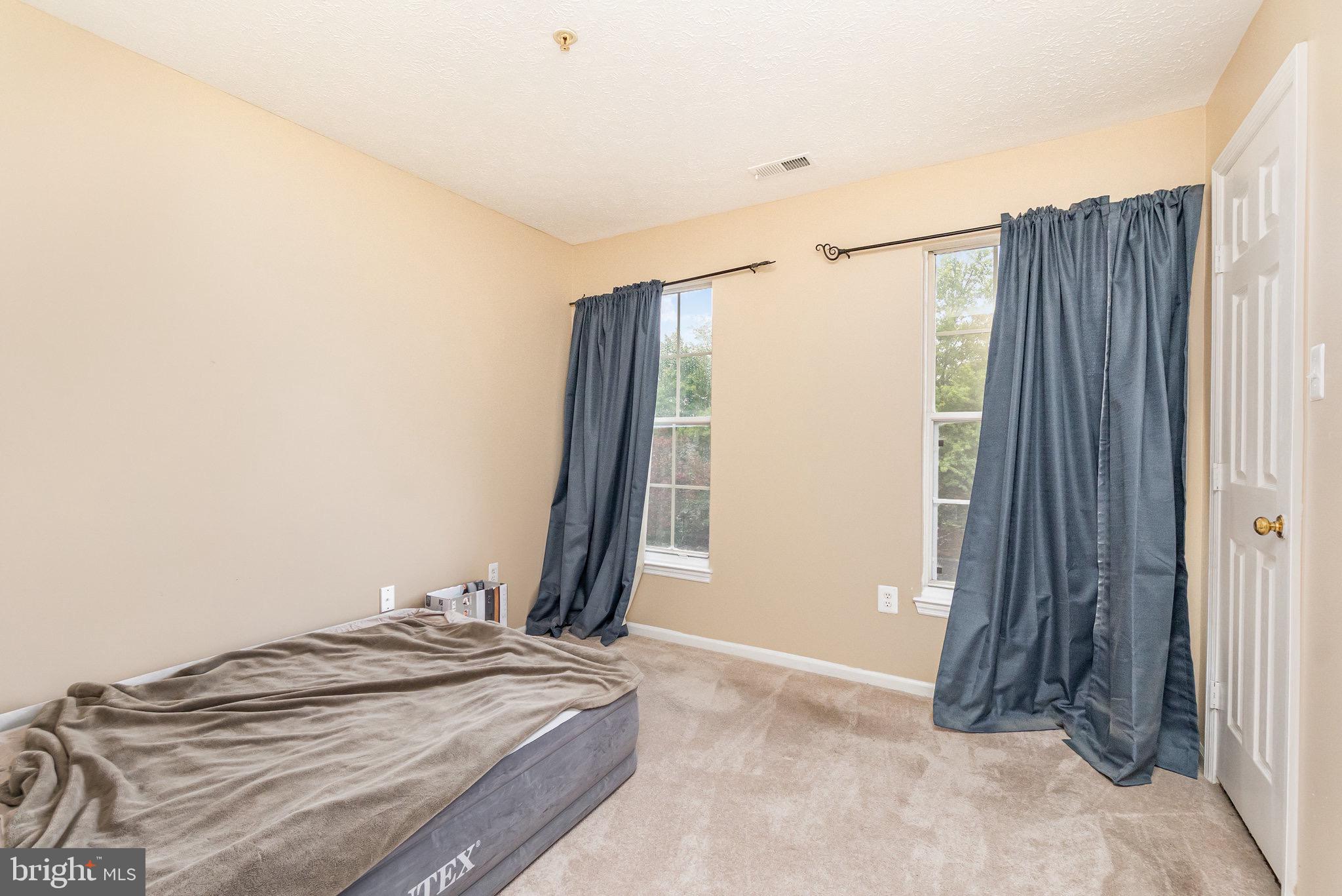 1401 Sage Lane, Unit 1401M Belcamp, MD 21017 - Photo 18 of 30 a view of a bedroom with closet