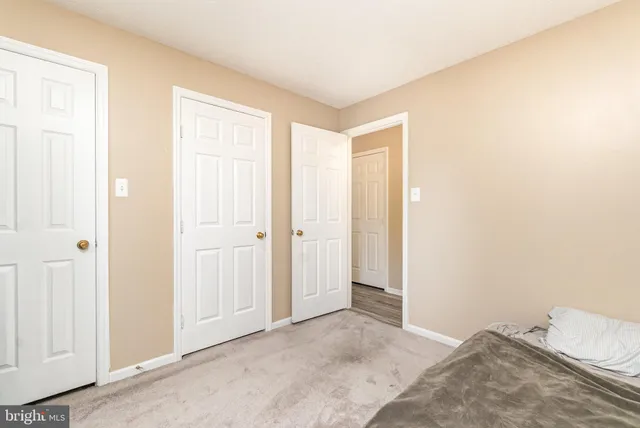 a white toilet sitting next to a bathroom sink and a shower