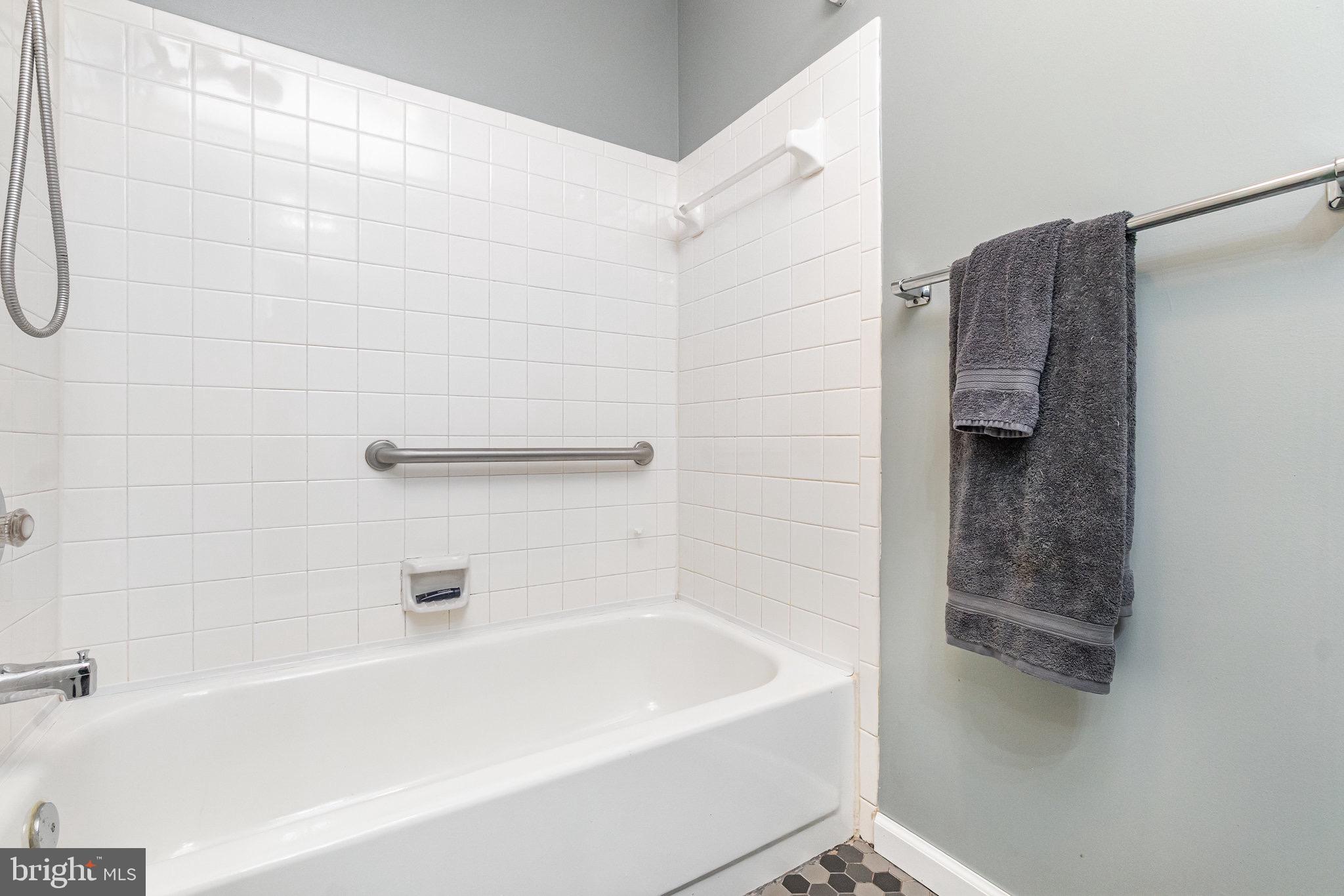 1401 Sage Lane, Unit 1401M Belcamp, MD 21017 - Photo 21 of 30 a bathroom with a bathtub and a shower