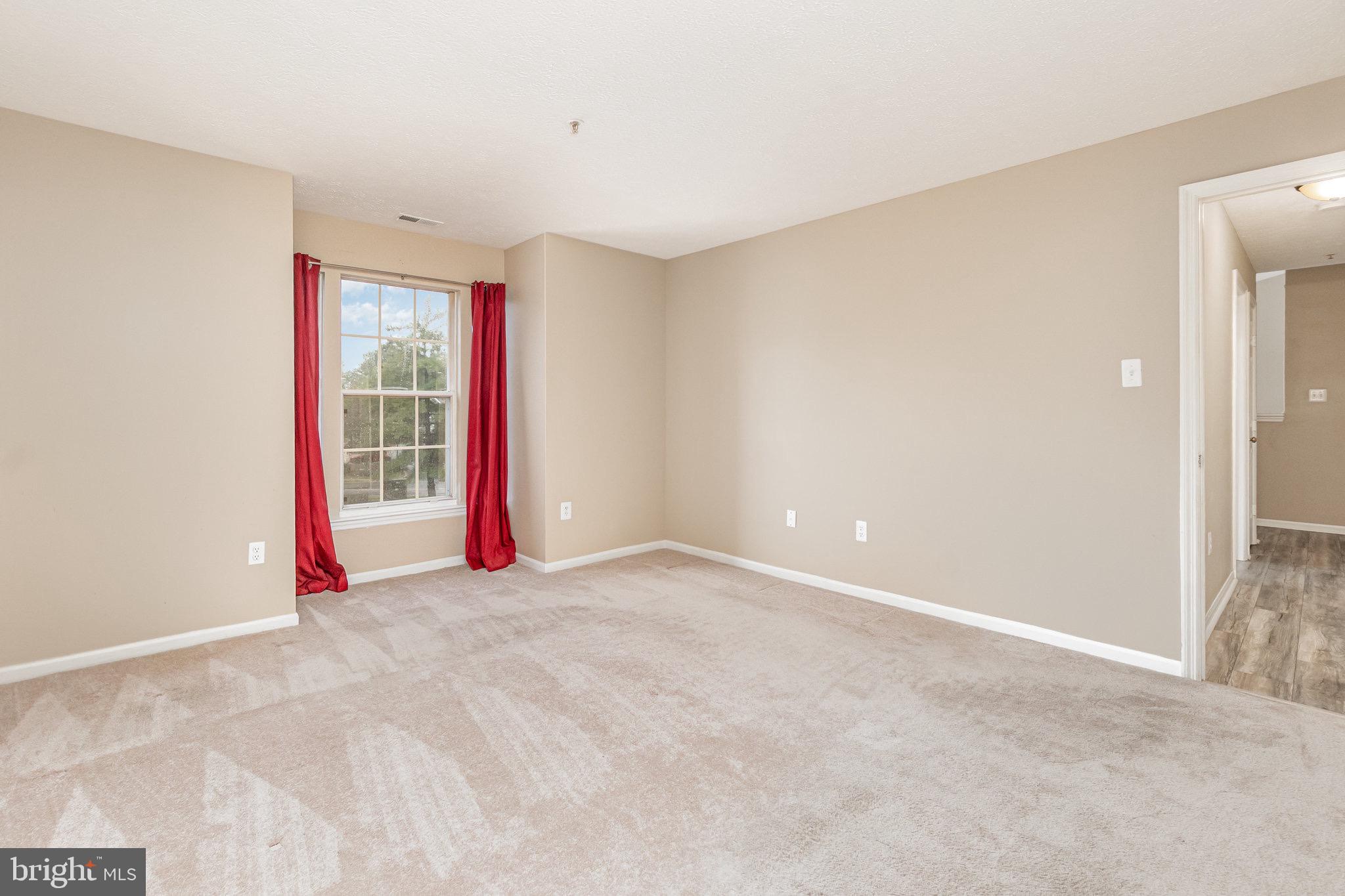 1401 Sage Lane, Unit 1401M Belcamp, MD 21017 - Photo 24 of 30 a view of a room with wooden floor and entryway