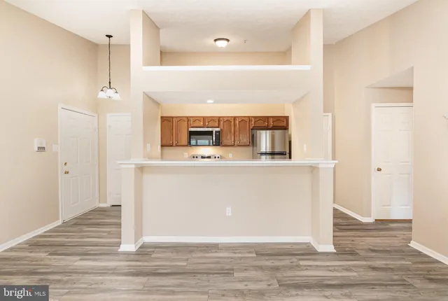a view of a kitchen cabinets and living room
