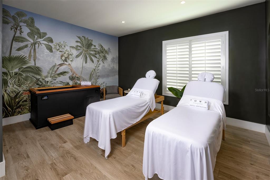 10535 Hamilton Dawn Street, Unit 15300 Orlando, FL 32821 - Photo 15 of 20 a bedroom with two beds and a painting on the wall