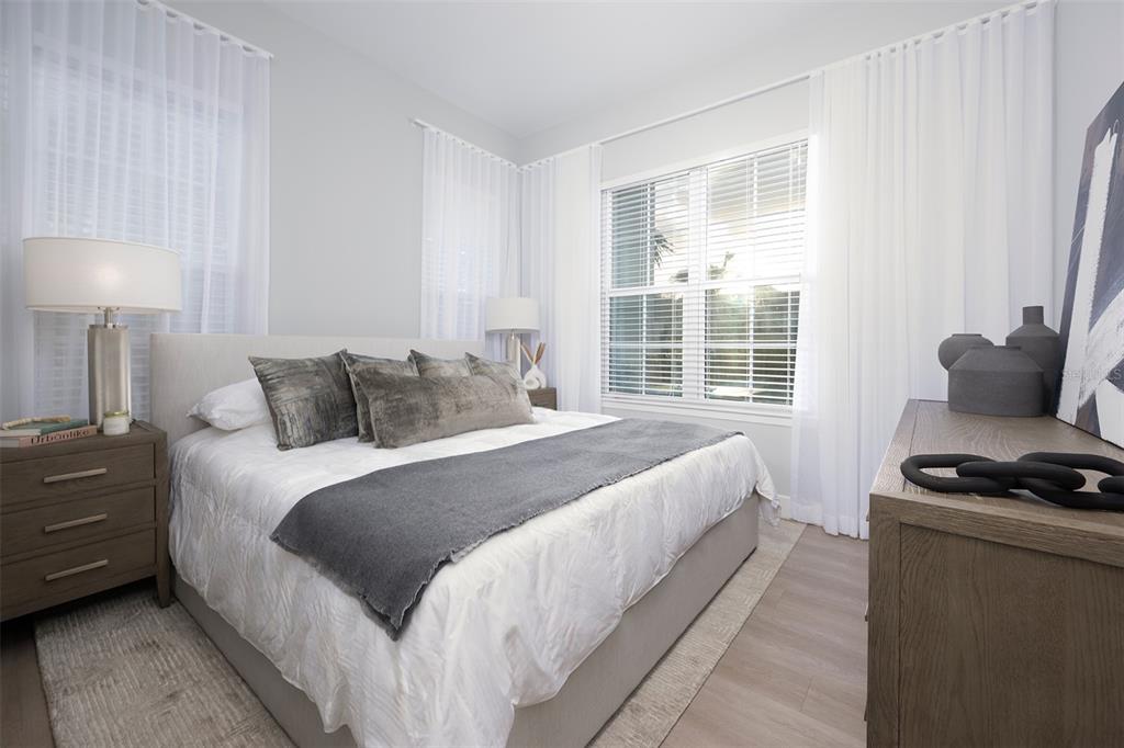 10535 Hamilton Dawn Street, Unit 15300 Orlando, FL 32821 - Photo 8 of 20 a bedroom with bed and window