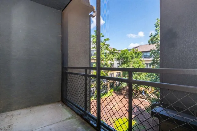 a view of balcony with chairs