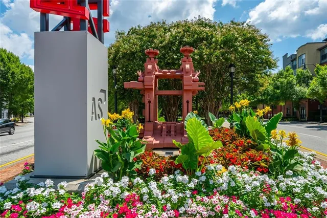 a row of pool with outdoor seating and a garden